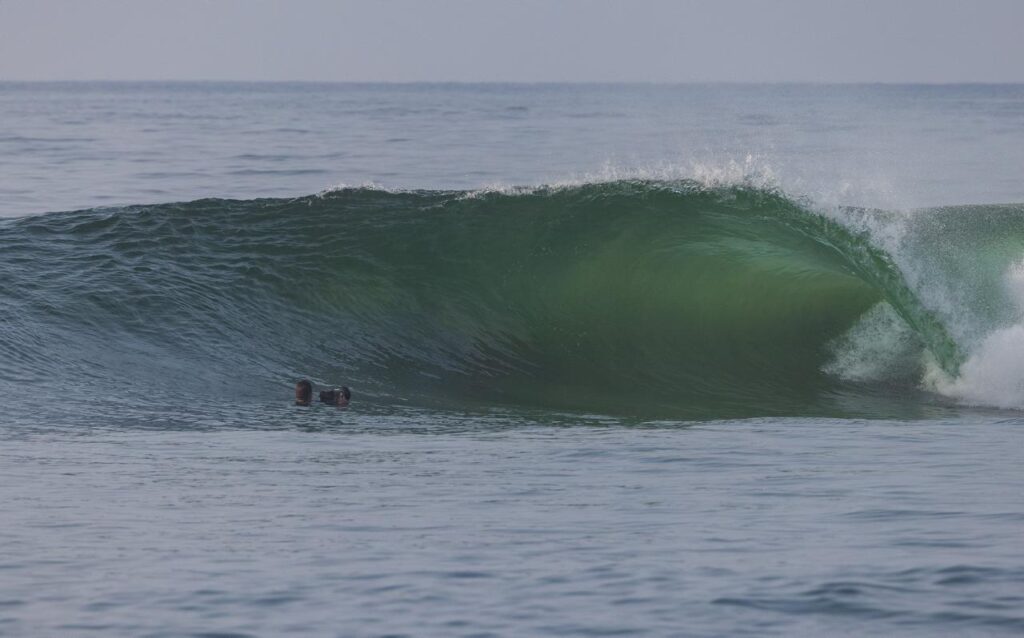 Professional water surf photographer filming a breaking wave in Salina Cruz, Oaxaca