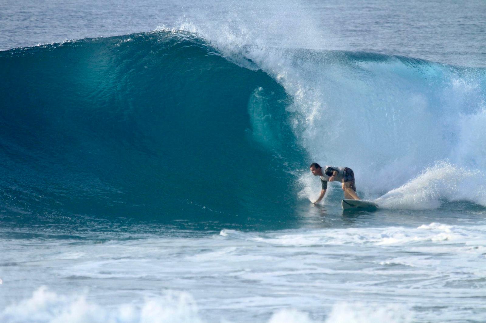 Surfer riding a powerful wave in Salina Cruz, Oaxaca