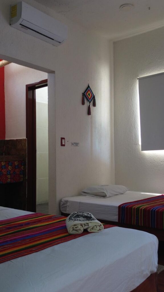Chipehua double room at LunaCoral Surf House in Salina Cruz with three double beds