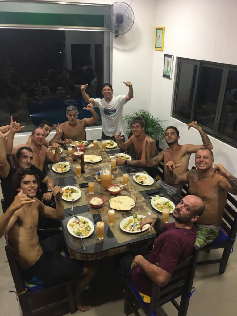 Surf team sharing dinner at LunaCoral Surf House in Salina Cruz